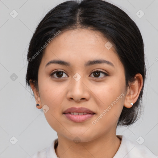 Joyful latino young-adult female with medium  brown hair and brown eyes