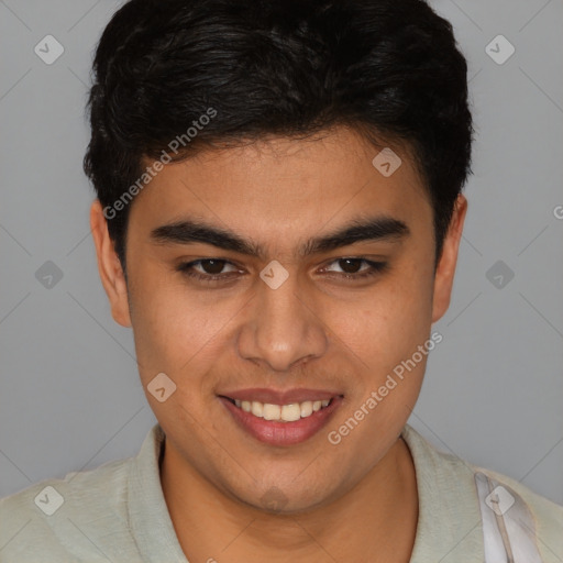 Joyful latino young-adult male with short  brown hair and brown eyes