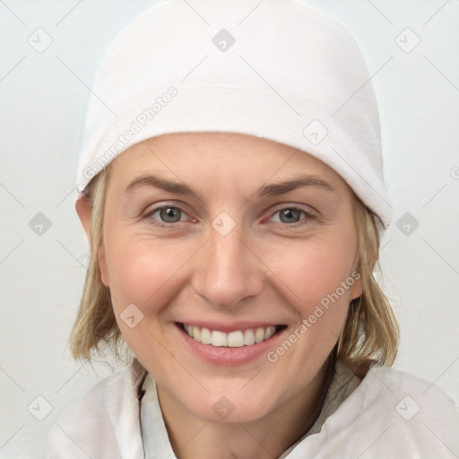 Joyful white young-adult female with medium  brown hair and blue eyes