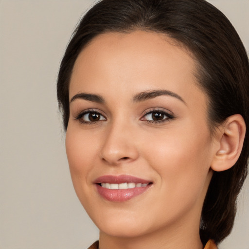 Joyful white young-adult female with medium  brown hair and brown eyes