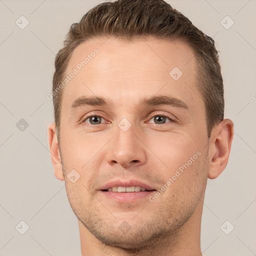 Joyful white young-adult male with short  brown hair and brown eyes