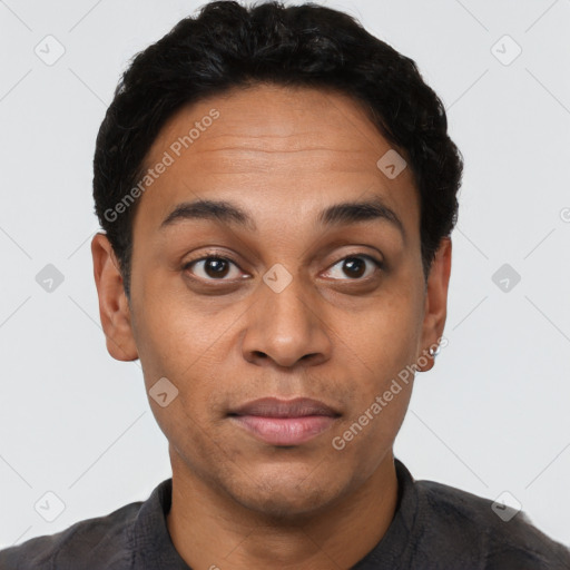 Joyful latino young-adult male with short  brown hair and brown eyes