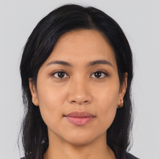 Joyful asian young-adult female with long  black hair and brown eyes