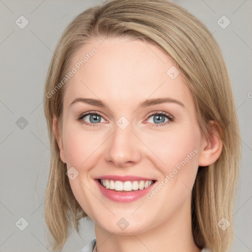 Joyful white young-adult female with medium  brown hair and blue eyes