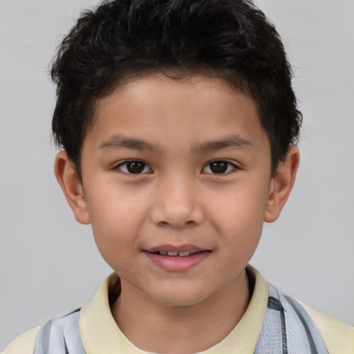 Joyful white child male with short  brown hair and brown eyes