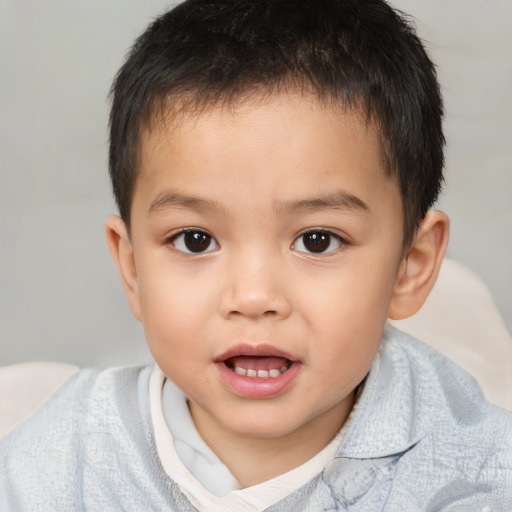 Joyful white child male with short  brown hair and brown eyes