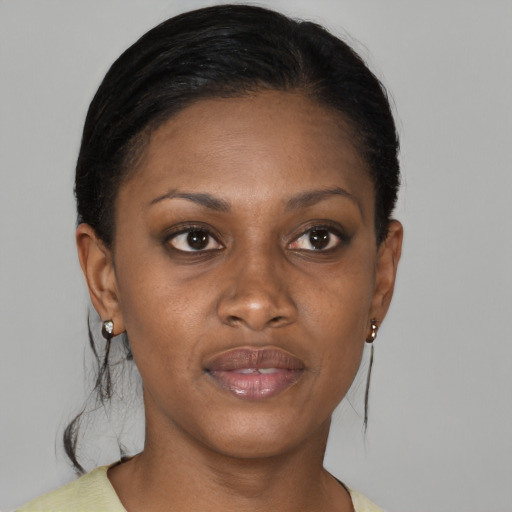 Joyful black young-adult female with medium  brown hair and brown eyes
