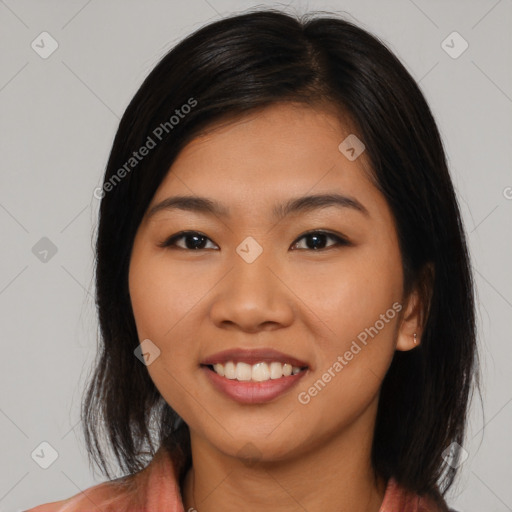 Joyful asian young-adult female with medium  black hair and brown eyes