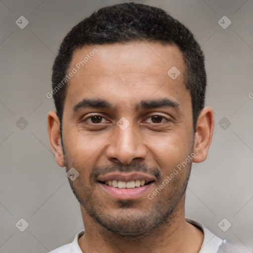 Joyful latino young-adult male with short  black hair and brown eyes