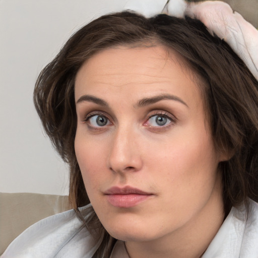 Neutral white young-adult female with medium  brown hair and brown eyes