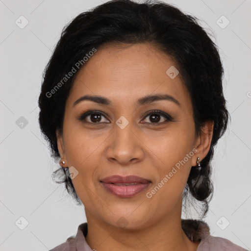 Joyful latino adult female with medium  brown hair and brown eyes