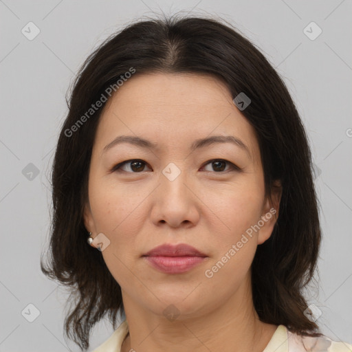 Joyful white adult female with medium  brown hair and brown eyes