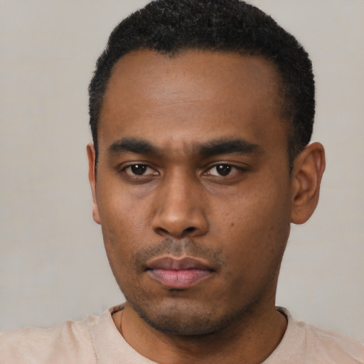 Neutral black young-adult male with short  black hair and brown eyes