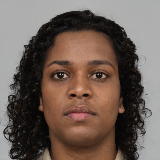 Neutral black young-adult female with long  brown hair and brown eyes