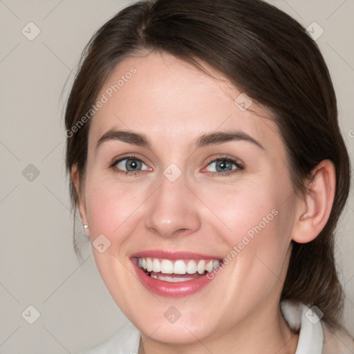 Joyful white young-adult female with medium  brown hair and blue eyes