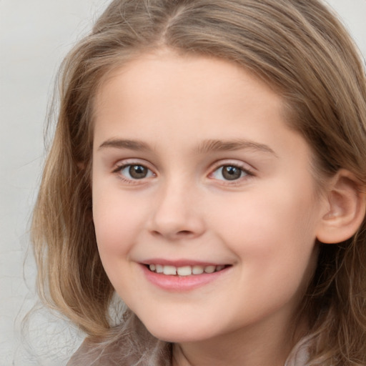 Joyful white child female with medium  brown hair and grey eyes