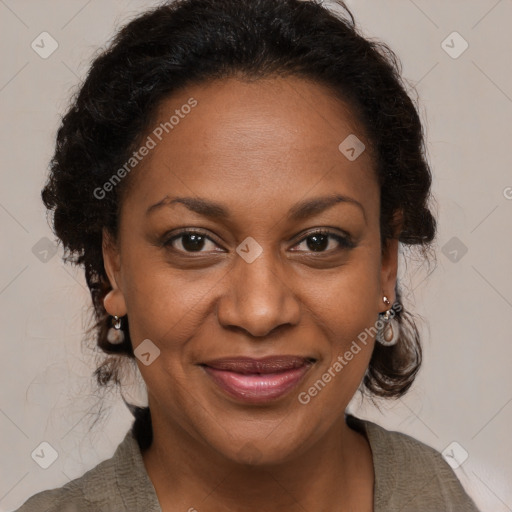 Joyful black adult female with medium  brown hair and brown eyes