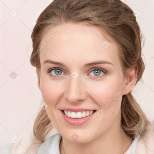 Joyful white young-adult female with medium  brown hair and blue eyes