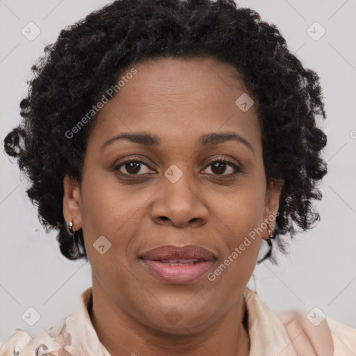 Joyful black adult female with medium  brown hair and brown eyes