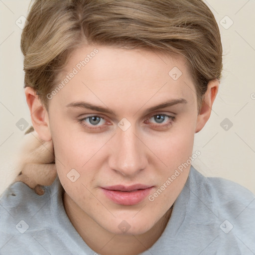 Joyful white young-adult female with short  brown hair and blue eyes