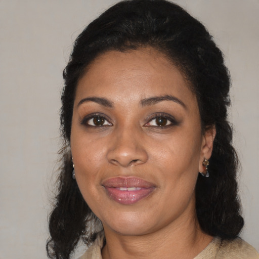 Joyful black adult female with medium  black hair and brown eyes