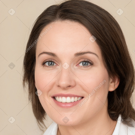 Joyful white young-adult female with medium  brown hair and green eyes