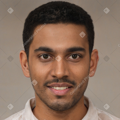 Joyful black young-adult male with short  black hair and brown eyes