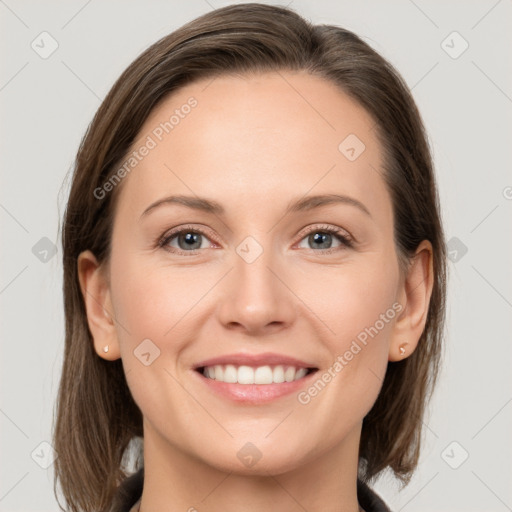 Joyful white young-adult female with medium  brown hair and grey eyes