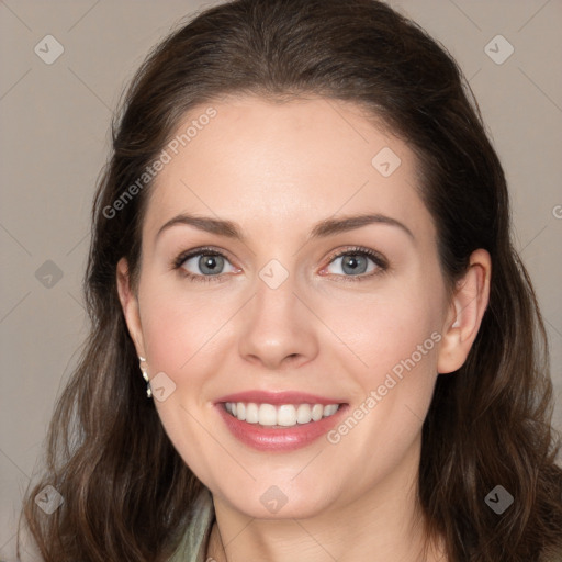 Joyful white young-adult female with long  brown hair and grey eyes