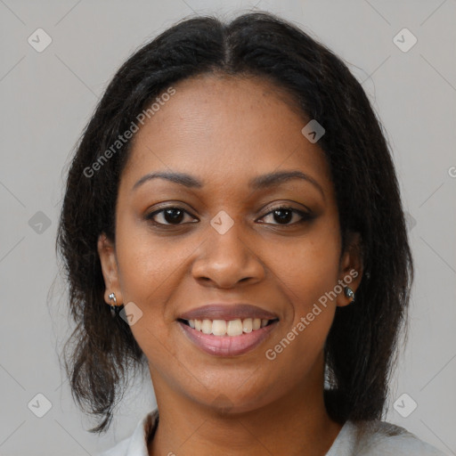 Joyful black young-adult female with medium  brown hair and brown eyes