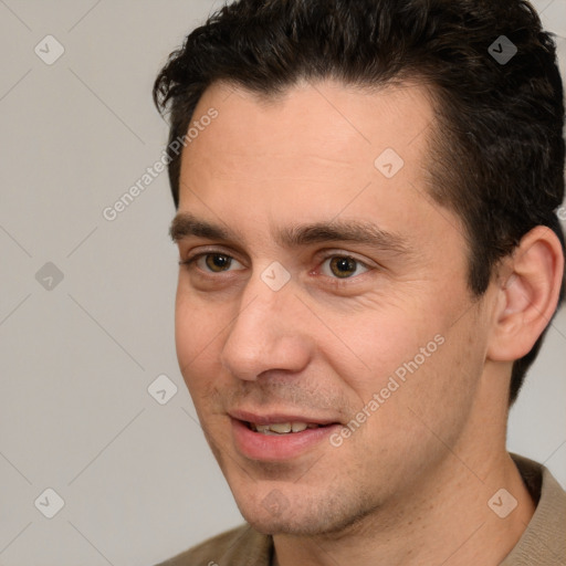 Joyful white adult male with short  brown hair and brown eyes