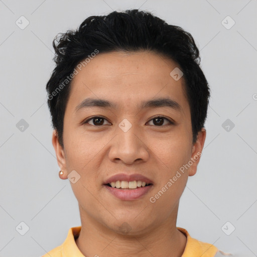 Joyful asian young-adult male with short  black hair and brown eyes