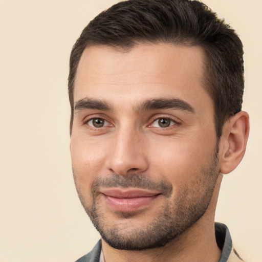 Joyful white young-adult male with short  brown hair and brown eyes