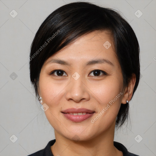 Joyful asian young-adult female with medium  black hair and brown eyes