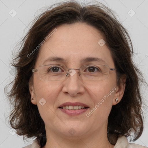 Joyful white adult female with medium  brown hair and brown eyes