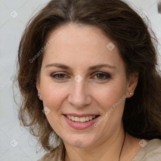 Joyful white adult female with long  brown hair and brown eyes