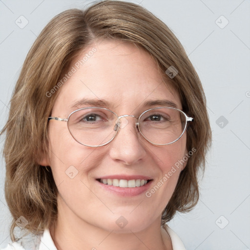 Joyful white adult female with medium  brown hair and blue eyes