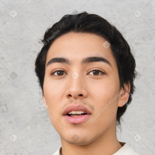 Neutral latino young-adult male with short  black hair and brown eyes