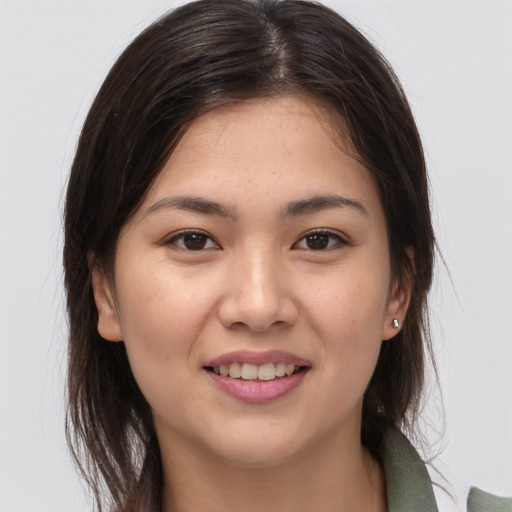 Joyful white young-adult female with medium  brown hair and brown eyes