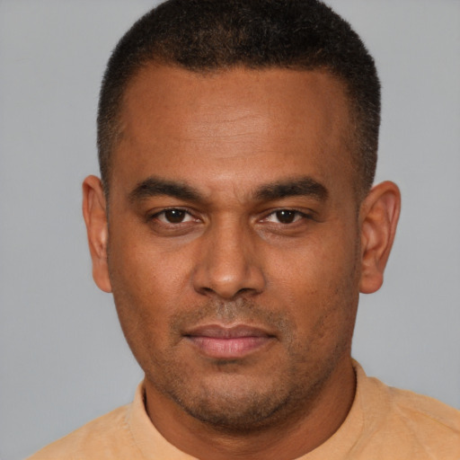 Neutral latino young-adult male with short  brown hair and brown eyes