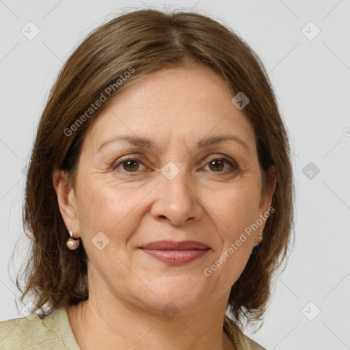 Joyful white adult female with medium  brown hair and brown eyes