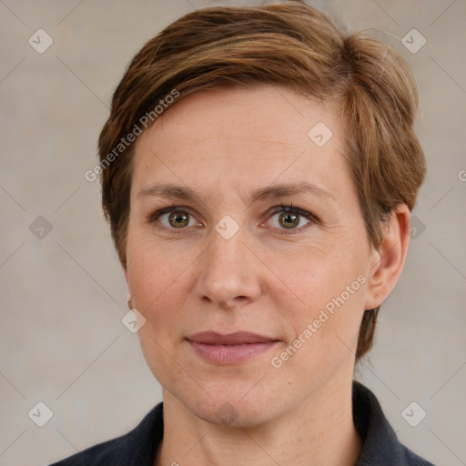 Joyful white adult female with short  brown hair and grey eyes