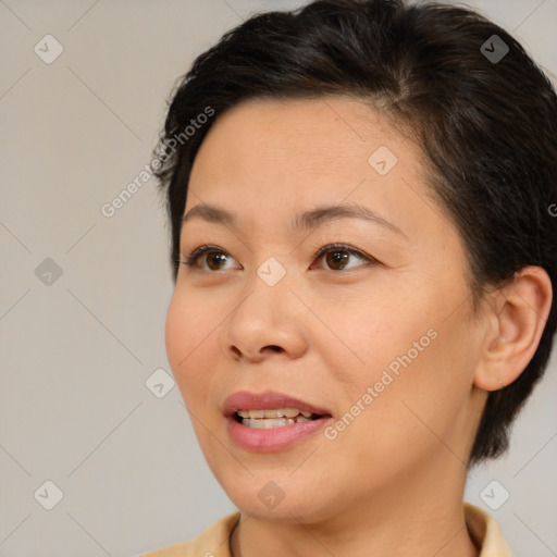 Joyful white young-adult female with medium  brown hair and brown eyes