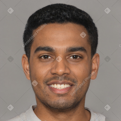 Joyful black young-adult male with short  black hair and brown eyes