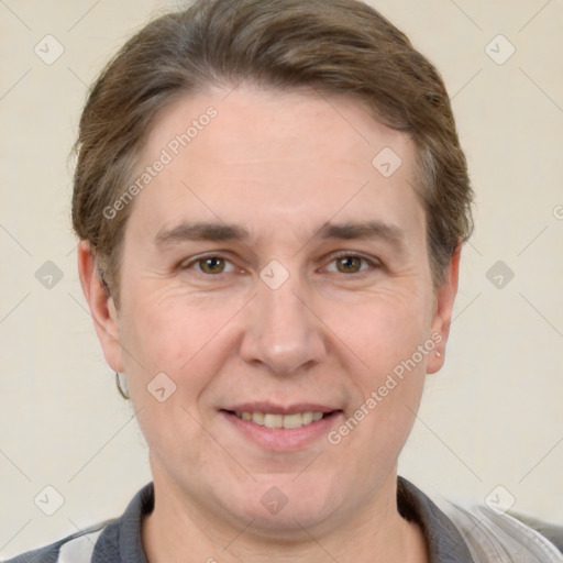 Joyful white adult male with short  brown hair and grey eyes