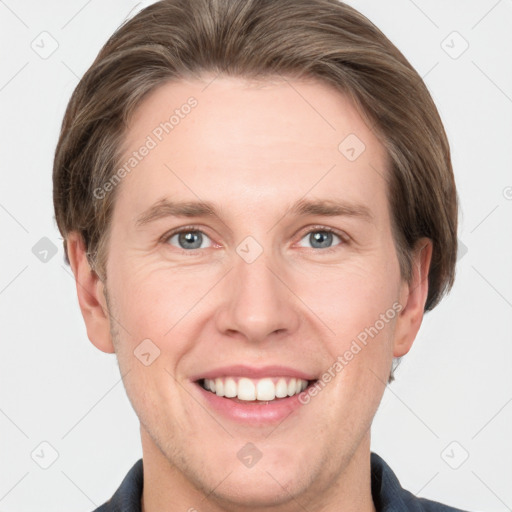 Joyful white adult male with short  brown hair and grey eyes