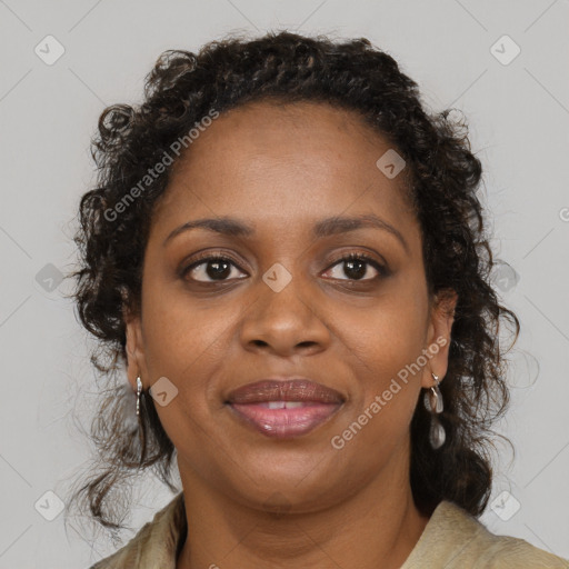 Joyful black adult female with medium  brown hair and brown eyes