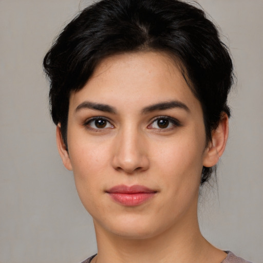 Joyful white young-adult female with medium  brown hair and brown eyes