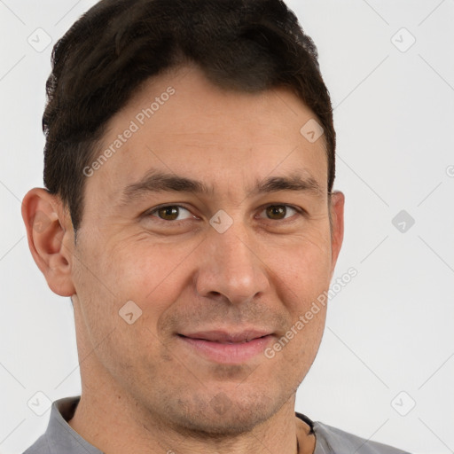 Joyful white adult male with short  brown hair and brown eyes