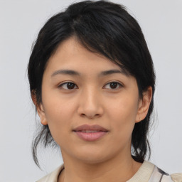 Joyful asian young-adult female with medium  black hair and brown eyes